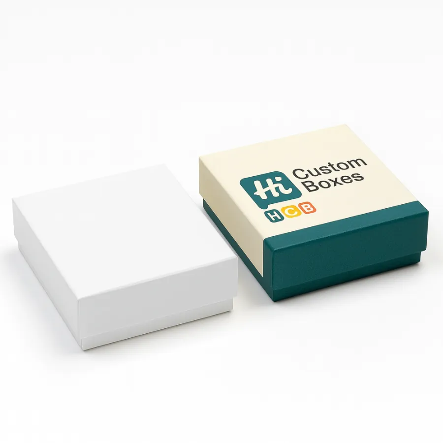 Two small- square rigid lift-off lid boxes for handkerchiefs- one branded- one plain white- class=