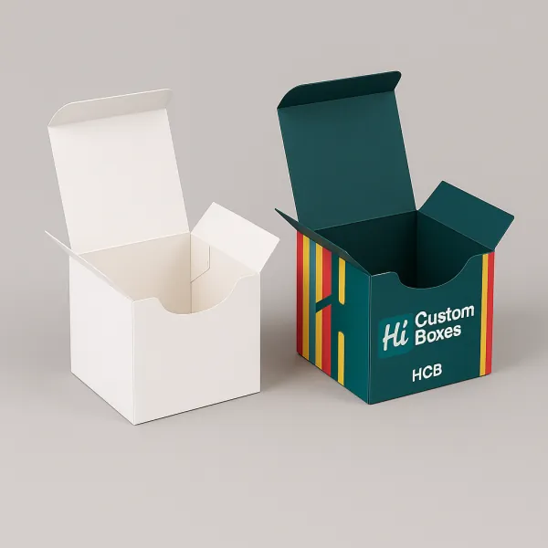 Two open tuck top boxes one plain white one custom printed with Hi Custom Boxes logo and stripes