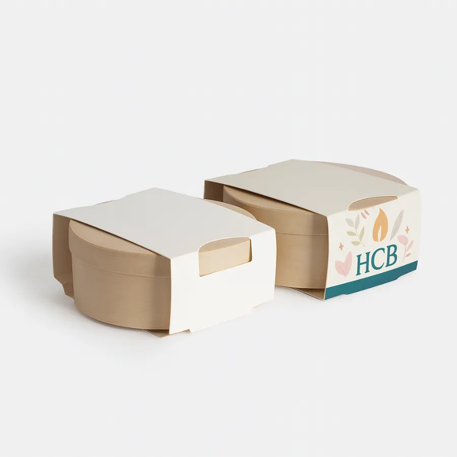 Round candle boxes with top sleeves- one plain white and the other featuring HCB logo with decorative pastel floral accents- class=
