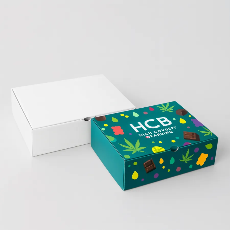 Two flat- square- lift-off lid boxes for edibles packaging- one plain white and one with a colourful -HCB- logo and pattern- class=