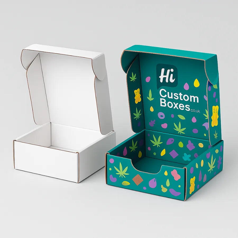 Two open mailer-style boxes for edibles packaging- one plain white and one fully printed with a colourful leaf and candy pattern- class=