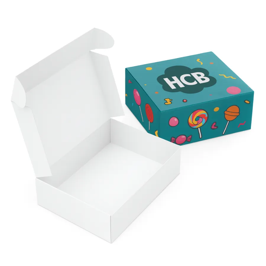 Two mailer-style boxes for candy- one open plain white and one closed- printed in teal with lollipop graphics and an -HCB- logo- class=