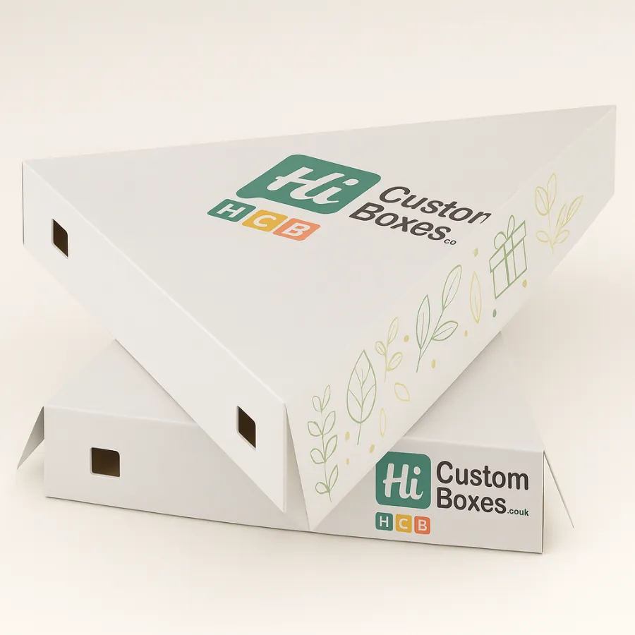 Wholesale printed triangular kraft boxes in white- stacked with custom green and yellow logo- and decorative leaf and gift box outlines- class=