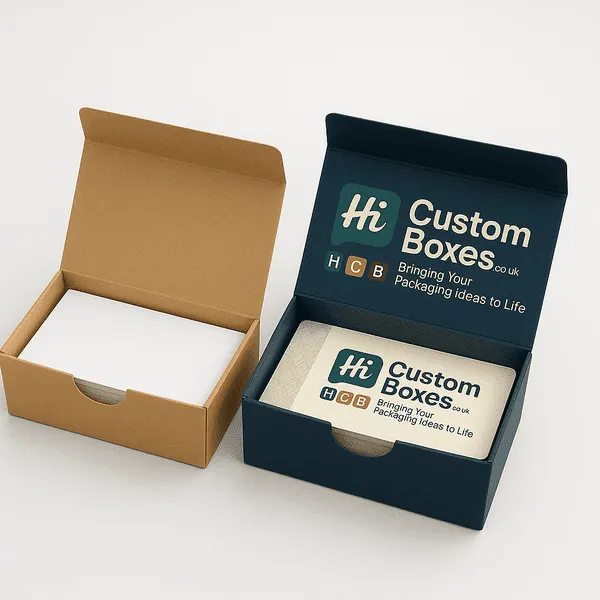 Two tuck top boxes side by side one plain kraft box with white contents and one printed dark blue box with Hi Custom Boxes class=