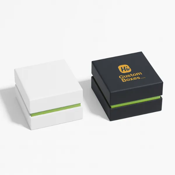 Closed square gift boxes - one plain white- one black with gold Hi Custom Boxes logo- class=
