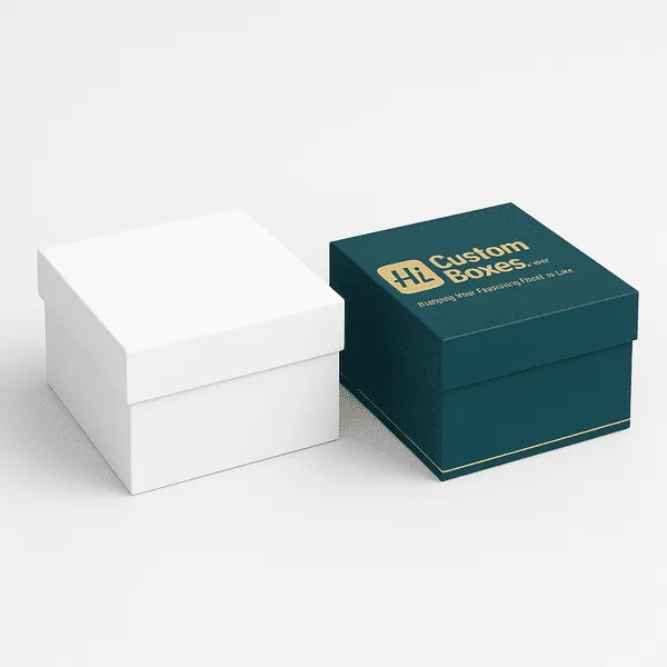 Two square rigid gift boxes with lift off lids one plain white and one teal with gold Hi Custom Boxes logo class=