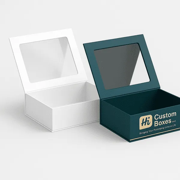 Two open rigid boxes with clear window lids one plain white and one teal with gold Hi Custom Boxes branding class=
