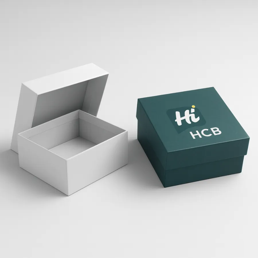 Square custom two-piece rigid gift boxes- A white box is shown with its lid open next to a dark teal box with a custom-printed logo on the lid-