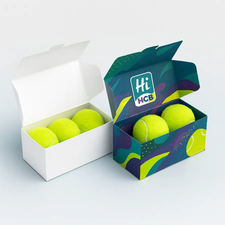 Custom printed Hi HCB packaging box with colorful abstract graphics holding three neon yellow tennis balls- shown beside a plain white box- class=