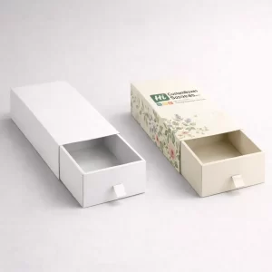 Two tall rectangular reed diffuser cartons, one blank white and one printed with floral graphics.