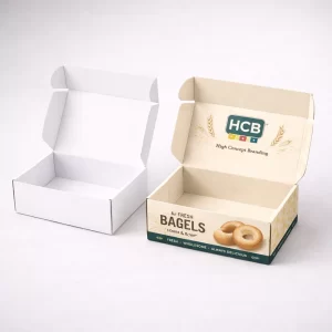 Two rigid cardboard gift boxes for bagels, one plain white and one with a luxury branded finish.