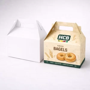 Two square cardboard cartons for bagel shipping, featuring a plain white and a colourful wholesale design.