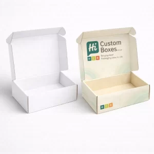Pair of open corrugated cardboard boxes, displaying a clean white interior and a branded lid.