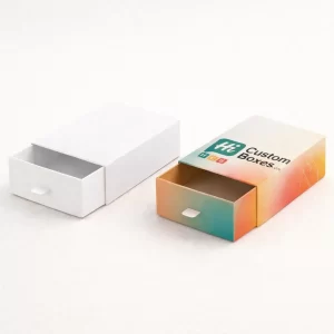 Two drawer-style slide boxes with small pull tabs, displaying a vibrant teal and orange gradient design.