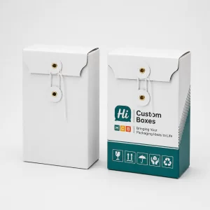 Elegant white and teal gift boxes with classic string and button closures.