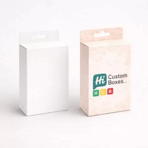 Rectangular retail boxes with euro hanging slots, featuring a clean white and a decorative pink finish.