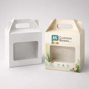 Two rectangular lidded gift boxes, one solid white and one with vibrant pink and gold branding.