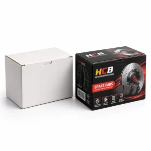 Two sleek black and yellow brake pad boxes featuring professional automotive branding and technical illustrations.
