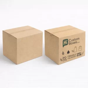 Two vertical candle carton boxes, one in plain brown kraft and one featuring floral designs.