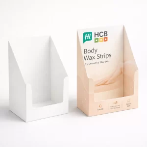 Two cardboard countertop display units, one plain white and one printed with peach branding and logo.
