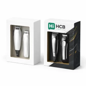 Two rectangular display boxes with windows showing hair clippers, one plain white and one branded.