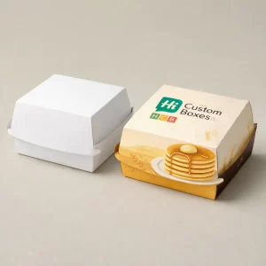 Vibrant custom printed pancake boxes showcasing illustrated toppings and a secure locking lid for delivery.
