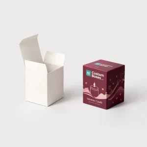 Two small tuck-top candle boxes, one minimalist white and one burgundy with a heart candle motif.