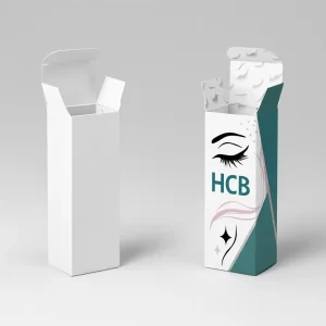 Tall tuck-top lash boxes- one plain white and one custom printed with HCB logo- eye and lash graphics- and teal sides- with printed lash patterns on the inside flaps