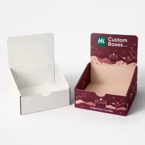 Two open cardboard display boxes, one plain white and one burgundy with Valentine's candle graphics.