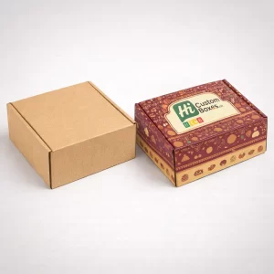 Two square two-piece rigid boxes, one plain white and one with elegant blue floral festival branding.