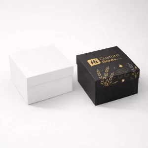 Two sturdy white two-piece boxes with lids, including one featuring luxury gold foil candle branding.