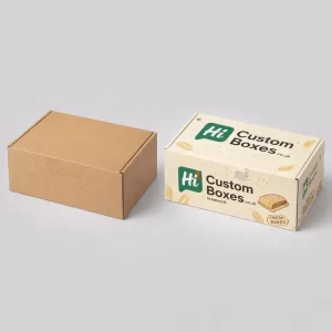 Plain brown cardboard shipping box next to a branded white and yellow loaf cake carton.