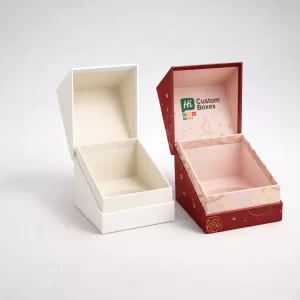 Two premium hinged gift boxes, one white and one red with gold rose patterns and branding.