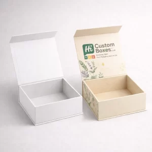 Two premium white reed diffuser boxes, one plain and one featuring elegant blue floral branding.