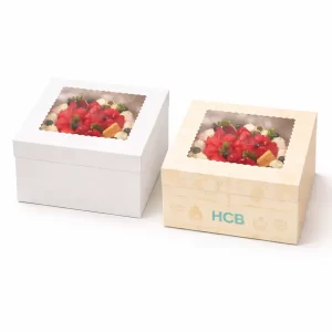 Two open flat-style cardboard boxes, one blank white and one with a colourful sitting dog illustration.