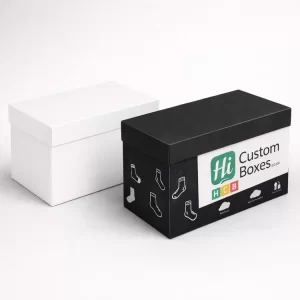 A plain white two-piece rigid box next to a black and white branded lid box.