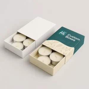 Two open, large square boxes, one white, one teal, containing twenty white tealight candles.