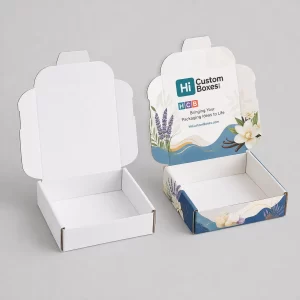 Open cardboard mailer boxes for wax melts, displayed in plain kraft and a colourful floral finish.