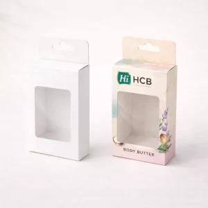 Two drawer-style slide boxes, one plain white and one featuring custom pink floral body butter designs.