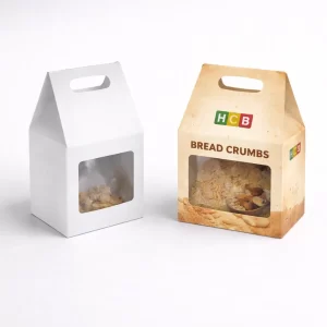 Plain white and custom-printed gable top boxes with die-cut windows showing breadcrumbs and a handle.