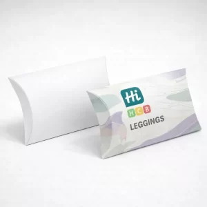 Two curved pillow boxes for clothing, one plain white and one with colourful patterned branding.