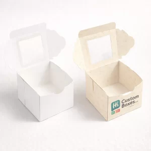 Tall white and patterned gable boxes with transparent windows for professional bakery product display.