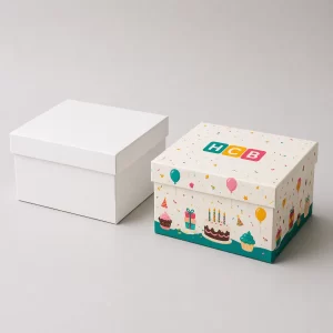 Two sturdy white cardboard boxes designed for safe transport of large square birthday cakes.