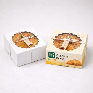 Customised cardboard croissant packaging box featuring a clear window to showcase fresh bakery treats inside.