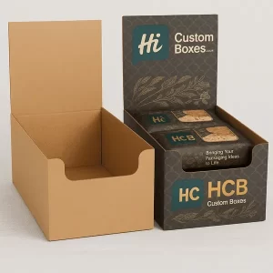 Open brown cardboard display boxes with dark green branded printed outer sleeves for retail.