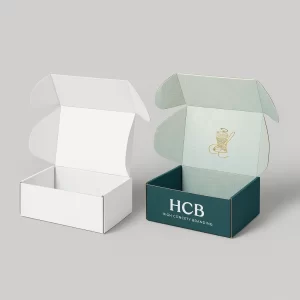 White and teal custom mailer boxes, open, designed for handkerchief packaging or small goods.