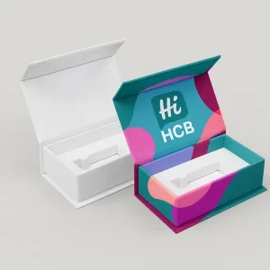 Magnetic closure rigid boxes with inserts- one plain white and one custom-printed with the HCB logo and colorful abstract patterns