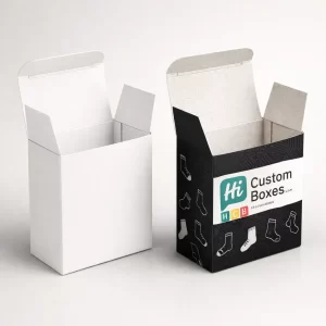 Two upright tuck-top cardboard boxes, one plain and one featuring a black patterned graphic design.