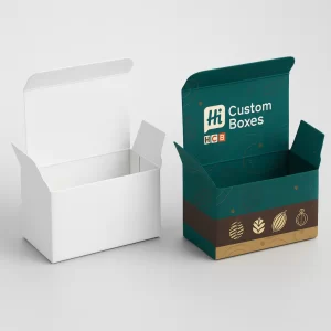 Plain white and branded folding cardboard boxes, open, for packaging chocolate truffles.