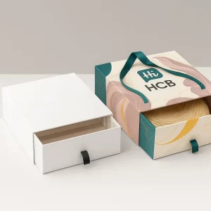 Premium rigid magnetic closure box with satin interior- plain version on the left and branded version on the right with HCB logo and teal bow ribbon